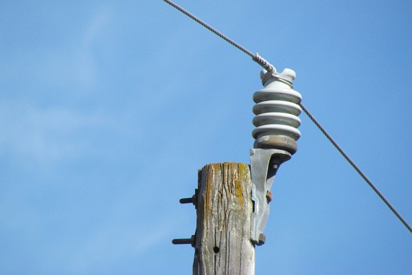 a high-voltage insulator on an electrical pole
