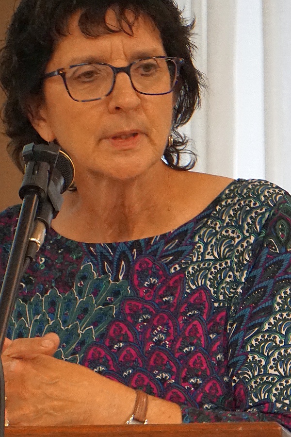 a close-up of caroll speaking