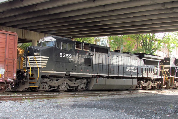 the engine connected to some boxcars